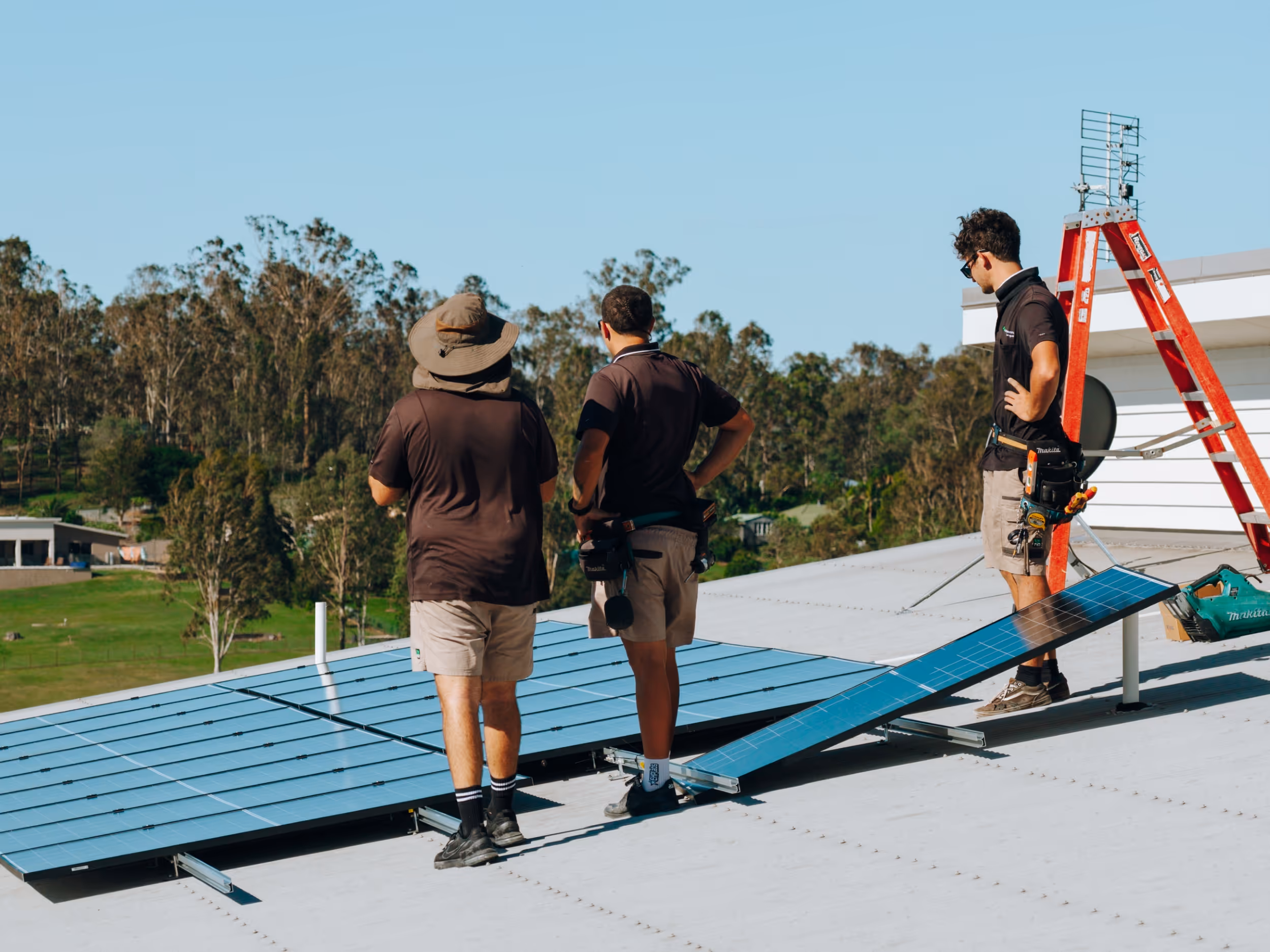 LMS Electrical in-house team installing commercial solar panels on a business property in South East Queensland.