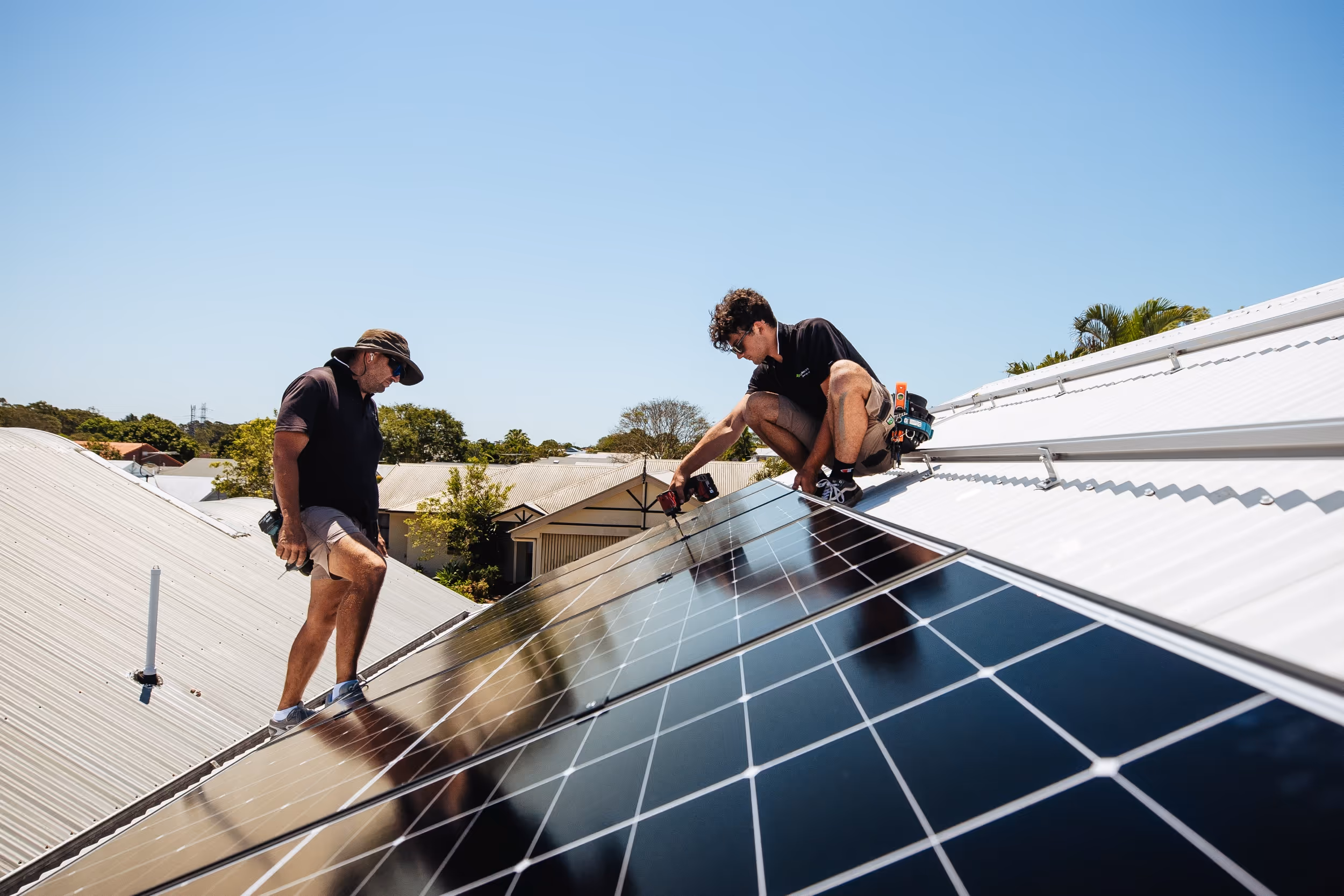 LMS Electrical in-house electricians performing professional solar panel maintenance and repair on a residential rooftop in South East Queensland.