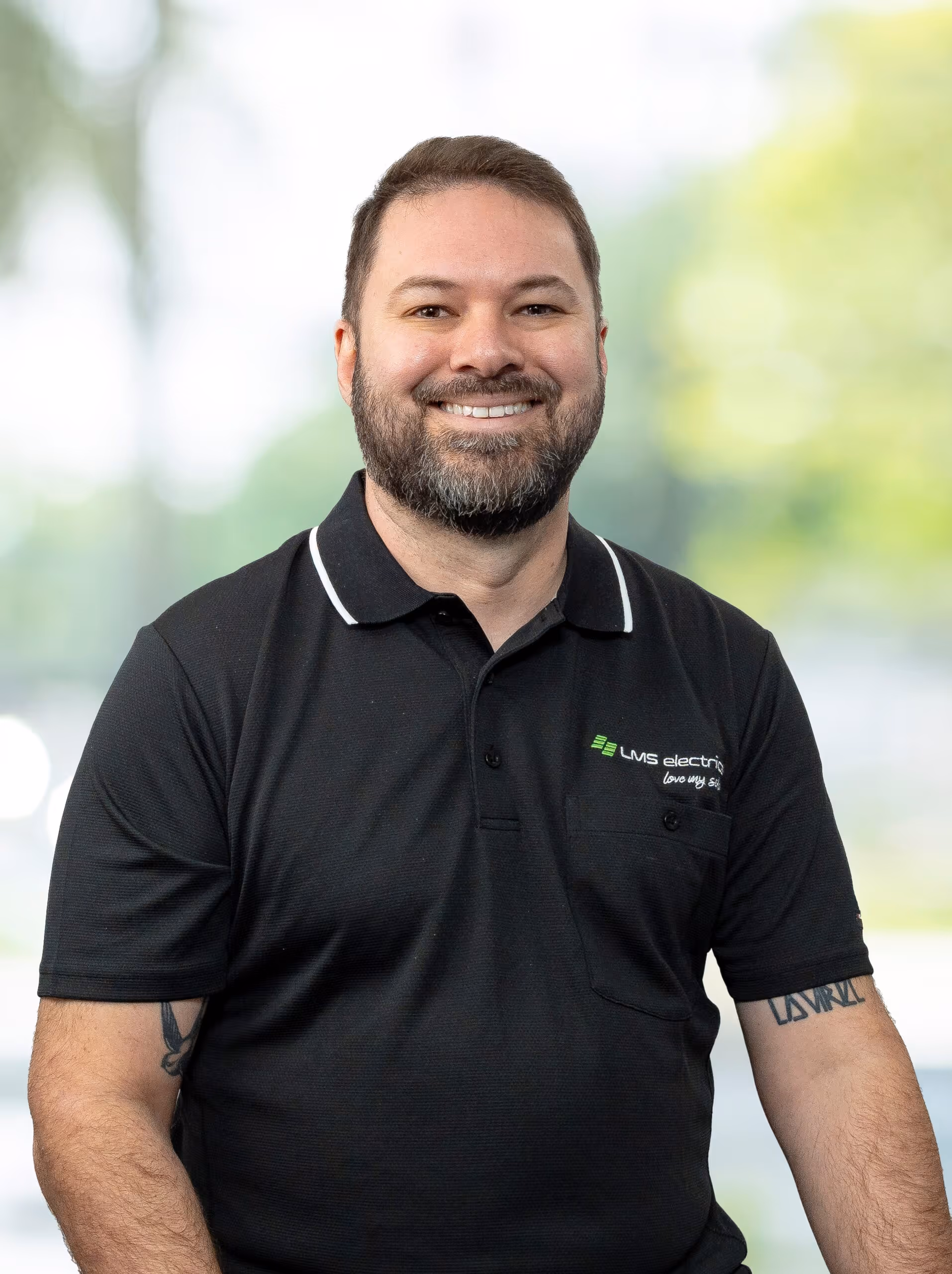 A professional headshot of Ben Evans, LMS Electrical solar expert.