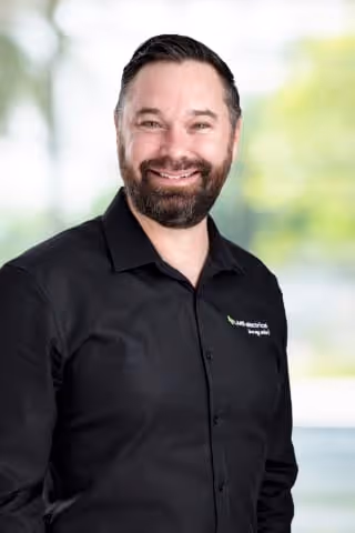 A professional headshot of Brett Spitz, LMS Electrical business operations.